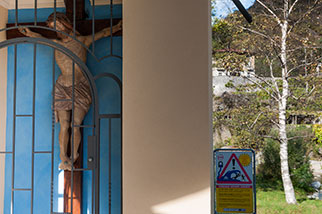 Ticino river island, Giornico, Bassa Leventina, Ticino; crucifix, the hydroelectric plants may cause a sudden flooding anytime